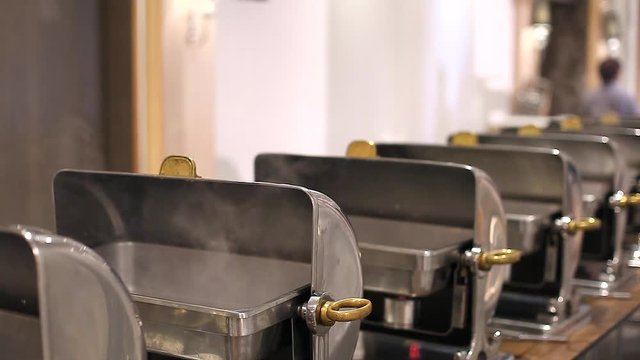Metallic Buffet Catering Food Preparation with Hot Steam