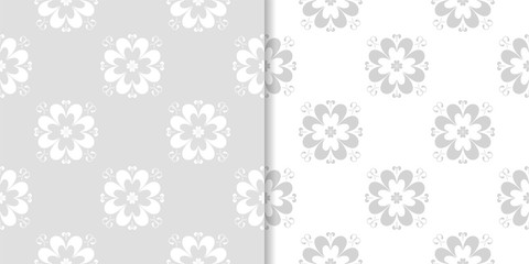 Light gray floral backgrounds. Set of seamless patterns