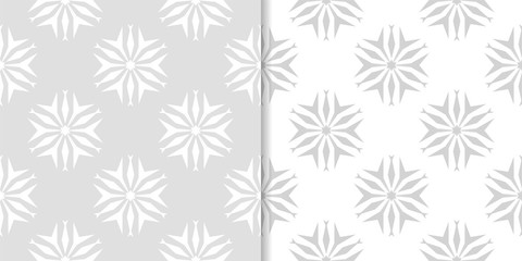 Light gray floral backgrounds. Set of seamless patterns