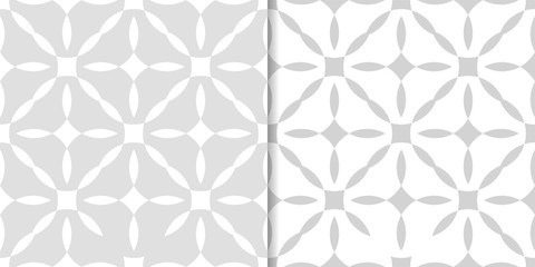 Light gray geometric ornaments. Set of seamless patterns