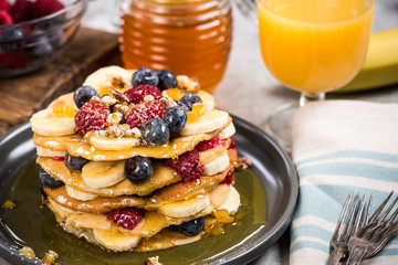 Healthy brunch with pancakes and juice.