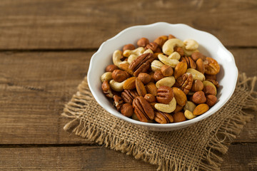 mixed nuts on wooden surface