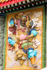colorful low relief of god warrior in Sik Sik Yuen Wong Tai Sin Temple,Hongkong