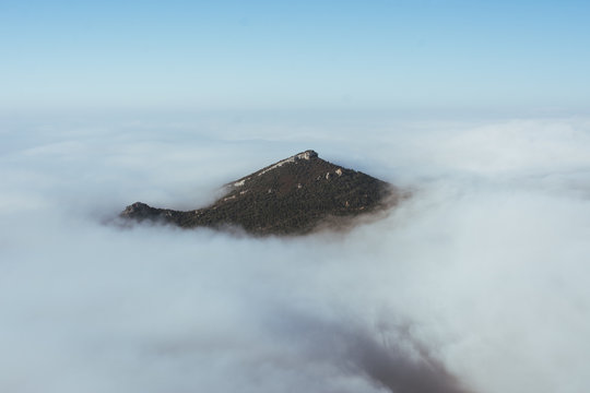 Mountain peak in thick clouds