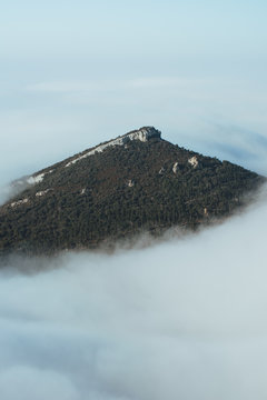 Mountain peak in thick clouds
