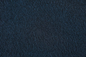 Texture of the sintepon. Dark brown background.