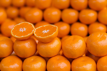 Fresh mandarin oranges texture. Honey Murcott oranges background. Pile oranges background. Oranges fruit. Orange in supermarket.