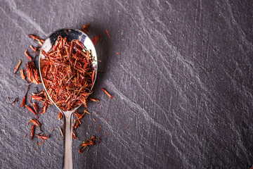  close up detail loose dried saffron on a spoon 
