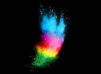 Freeze motion of colored powder explosions isolated on black background.