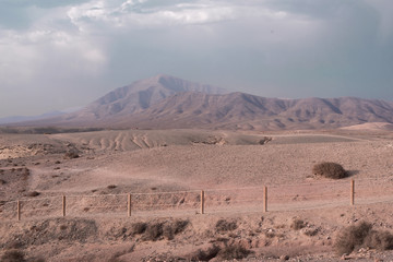 Desert landscape in Timanfaya National Park with mountains and golden valley in Lanzarote, Canary Islands