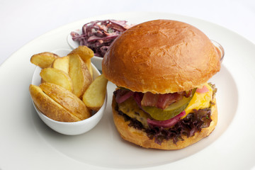 Grass Fed Bison Hamburger with Lettuce and Cheese in white plate