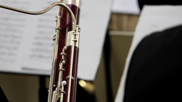 Footage of a musician playing on his bassoon...