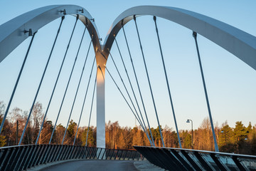 Fototapeta na wymiar Small bridge in the morning with blue sky as background