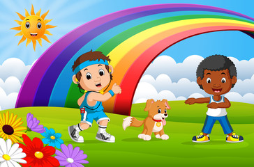 Children sport and dog in the park on rainbow day 
