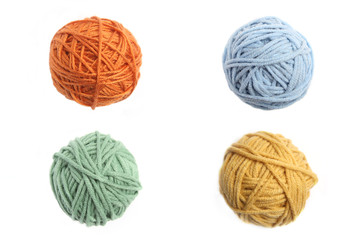Colorful cotton thread ball isolated on white background. Set of four color (orange, yellow, green, blue) thread balls.