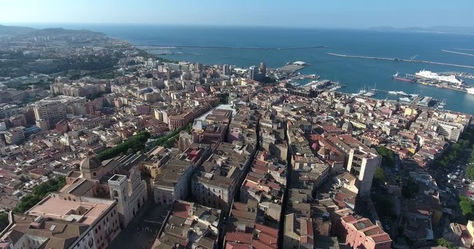 CAGLIARI, SARDINIA, ITALY  – JULY 2016 : Aerial shot over Cagliari cityscape on a beautiful day with view of harbour and city centre