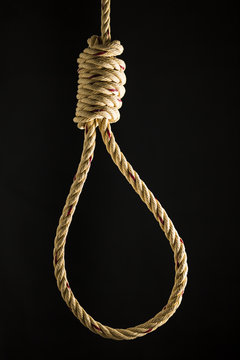 Brown rope noose dark and light on black background, concept of hanging suicide