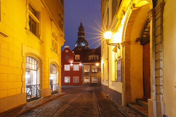 Fototapeta na wymiar Typical europeen medieval street and the Cathedral of Saint Mary at night, Riga, Latvia
