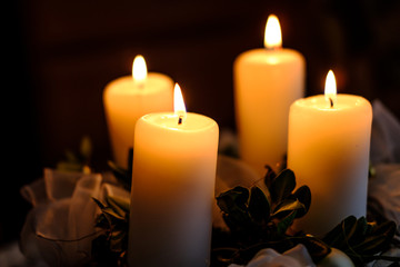 Beautiful four burning candles on advent wreath