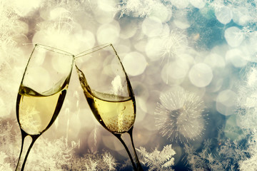Champagne glasses on sparkling background