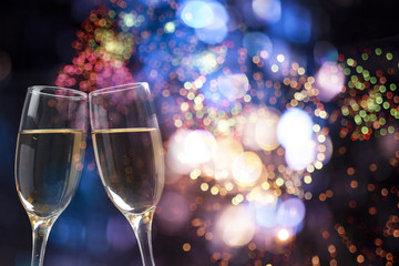 Champagne glasses on sparkling background