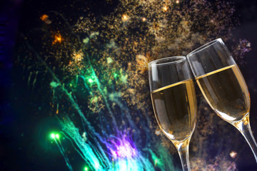 Champagne glasses on sparkling background