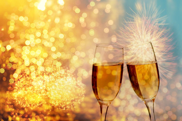 Champagne glasses on sparkling background