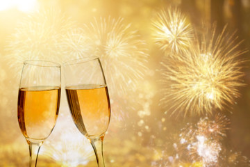 Champagne glasses on sparkling background