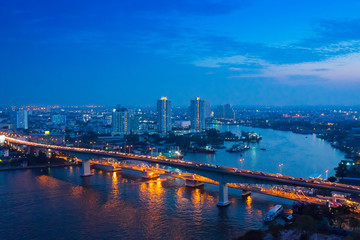 Bangkok river side cityscape. Bangkok night view in the business district. at twilight.Panorama...