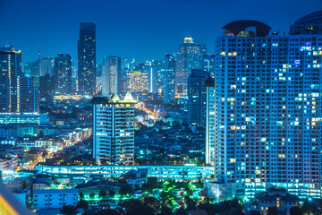 Fototapeta na wymiar Bangkok river side cityscape. Bangkok night view in the business district. at twilight.Panorama view of Bangkok city scape at night time. vintage colour tone