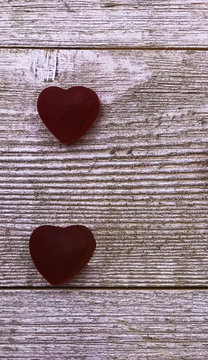 Candy hearts on gray wood background