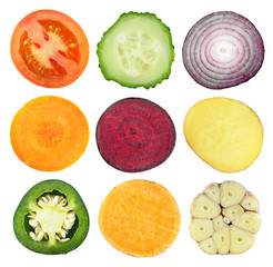 Set of slices of different raw vegetables isolated on white background