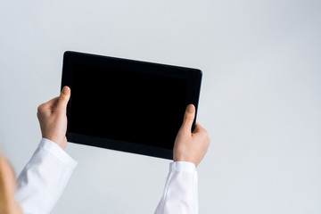 Close of female doctor hands working with tablet pc computer