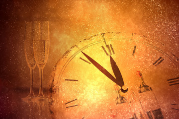 Champagne glasses and midnight clock. Happy New Year 
