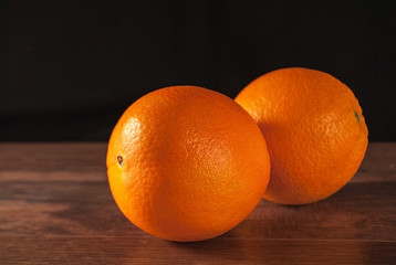 oranges on the surface, black background