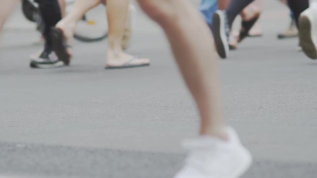 Slow Motion Shot Of Pedestrians Crossing A Street In Berlin In Summer.