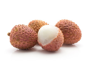 Four lychee isolated on white background ripe pink fresh berries one peel.