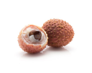 Two peel lychee with brown seed isolated on white background ripe pink fresh berries.
