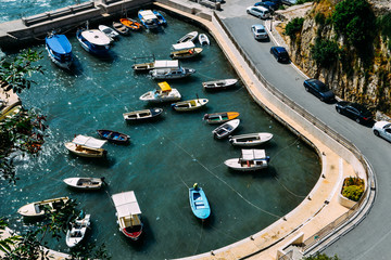 Fototapeta na wymiar Ulcinj, Montenegro. Ulcinj Bay, seen from above. A small harbor with many boats.