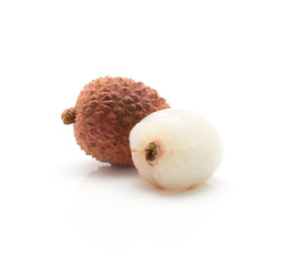 Two lychee one without shell isolated on white background ripe pink fresh berries.