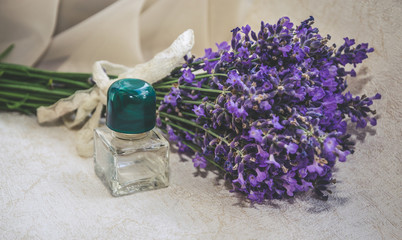Vintage composition with lavender, perfume bottle and old book
