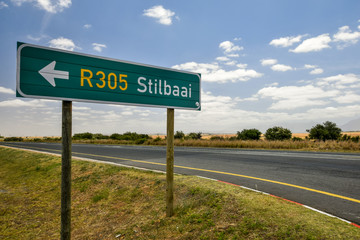 Road sign at the route N2 road in South Africa near Still Bay pointing to Still Bay (R305). The N2 is a national route that runs from Cape Town to Ermelo and is the main highway along the ocean.