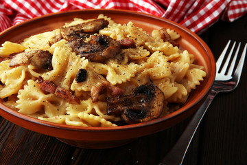 Italian pasta with fugi, farfalle fresh vegetables - cuisine