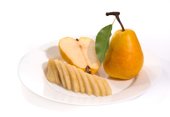 Yellow ripe pears, a single whole second sliced