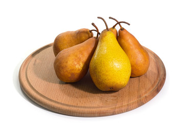 The ripe yellow pears on a tray isolated a white background