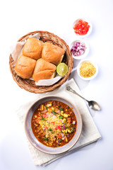 Misal Pav or misalpav, Misal Pav with Farsan. Traditional Indian spicy dish made with moth beans (match) and served with farina and bread   © StockImageFactory