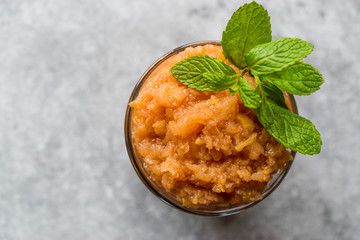 Homemade Italian Mandarin Granita Ice Cream with Mint.