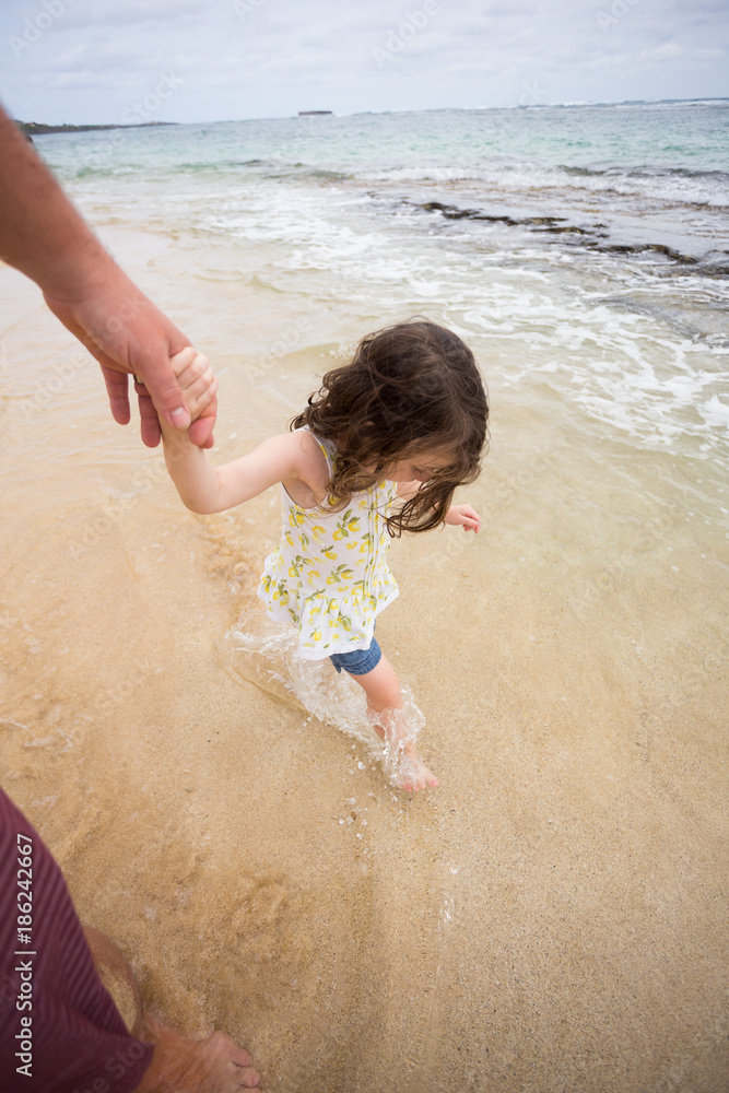 Canvas Prints child playing on beach in oahu hawaii