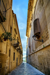 Famous Ortigia Alley in Syracuse, Sicily, Italy