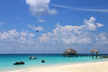 Blue sea and a jet ski floating on the sea, view of the propical beach and jet skis